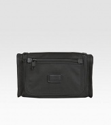 A classic travel kit made from signature ballistic nylon features include interior elastic loops, an outside zip pocket and webbing handle strap. Zip closure Nylon lining 10¾W X 6¼H X 3½ Imported 