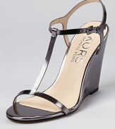 Modern and minimal, these sleek wedges from KORS Michael Kors boast clean lines on a simple silhouette.