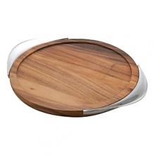 With its smooth curves and striking blend of materials, the Tilt Bar Tray has an almost planetary mood to it, a fitting complement to the canted axis of Tilt crystal. Fashioned with an acacia wood center and framed by tapered grips of gleaming Nambé alloy, the tray is a beautiful way to bring fresh cocktails to your friends or pass champagne at a celebration. The raised flat rim contains drips or errant ice cubes, and the contoured handles fit the palm and thumb with ease. The rich grain of the wood complements the high luster of the metal, and the overall combination is modern yet enduring. Designed by Todd Myers, the tray is an excellent gift for connoisseurs of bar-keeping elegance. With its smooth curves and striking blend of materials, the Tilt Bar Tray has an almost planetary mood to it, a fitting complement to the canted axis of Tilt crystal. Fashioned with an acacia wood center and framed by tapered grips of gleaming Nambé alloy, the tray is a beautiful way to bring fresh cocktails to your friends or pass champagne at a celebration. The raised flat rim contains drips or errant ice cubes, and the contoured handles fit the palm and thumb with ease. The rich grain of the wood complements the high luster of the metal, and the overall combination is modern yet enduring. Designed by Todd Myers, the tray is an excellent gift for connoisseurs of bar-keeping elegance.