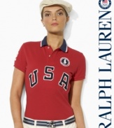 An essential short-sleeved polo shirt from Ralph Lauren is crafted in breathable cotton mesh with bold country embroidery, celebrating Team USA's participation in the 2012 Olympic Games.