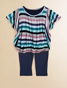 A rainbow of colors adorn the tunic of this cozy set for baby with matching leggings. Tunic Crewneck with V-insetLong raglan sleevesPullover style Leggings Elastic waistbandTop: rayonLeggings: 95% cotton/5% spandexMachine washImported