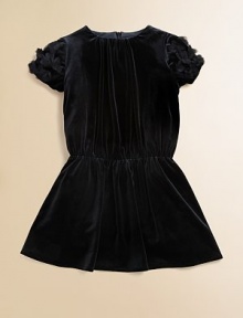 In lush velvet with flower details at the sleeves, this classic dress is perfect for stylish little ones.CrewneckGathered at neckBack zip closureShort sleeves with flower detailsElastic waistFull skirtPolyesterFully linedDry cleanMade in the USA of imported fabric