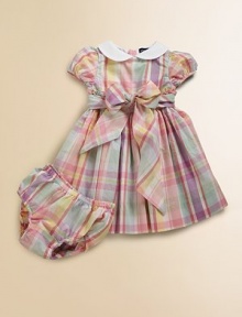 Pretty cotton madras dress in a sweet empire silhouette, perfect for the warmer-weather seasons.Solid Peter Pan collarShort puffed sleevesCovered buttons at back of neckRuffle trimmed empire waist with bow tie detailPleated, lined skirtMatching bloomersCottonMachine washImported Please note: Number of buttons may vary depending on size ordered. Pretty cotton madras dress in a sweet empire silhouette, perfect for the warmer-weather seasons.Solid Peter Pan collarShort puffed sleevesCovered buttons at back of neckRuffle trimmed empire waist with bow tie detailPleated, lined skirtMatching bloomersCottonMachine washImported Please note: Number of buttons may vary depending on size ordered.
