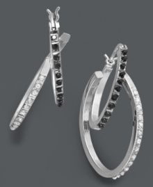 A simple twist makes a stylish impact. Doubled hoop earrings make a statement in contrasting black and white diamond accents. Set in sterling silver. Approximate drop length: 1-1/4 inches. Approximate drop width: 3/4 inch. A simple twist makes a stylish impact. Doubled hoop earrings make a statement in contrasting black and white diamond accents. Set in sterling silver. Approximate drop length: 1-1/4 inches. Approximate drop width: 3/4 inch.