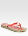 Traditional thong design with a goldtone designer embellishment and foam footbed. Rubber upperFoam solePadded insoleImportedOUR FIT MODEL RECOMMENDS ordering true size. 