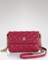 Skip the staid shades and opt for vibrant accents like Marc Jacobs' quilted leather bag. Take your cues from the runways and carry this style to enliven slick black leathers.