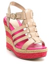 Hot pink stripes race around the wedge heel of Aqua's Delhi espadrille, paired with a caged vamp in neutral nude leather.