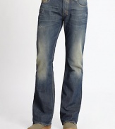 A rugged denim design with distressed elements, finished in a resin and golden spray. Banded waist with belt loopsFront zip and button closureFive-pocket styleFaded, whiskered and frayed detailsSignature stitching on back pockets Back patch detail Bootcut silhouetteInseam, about 34 Cotton Machine wash Imported