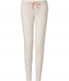 More chic than your average thermal, these neutral lounge pants from Juicy Couture will stylishly enliven your casual at-home style - Elasticized waist with bow drawstring, slim fit, large cuffs at hem - Wear with a matching camisole, fuzzy slippers, and a cozy robe