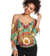 Oh-so trend-forward, this scarf-print blouson top comes fully equipped with shoulder-flaunting cutouts and chic getaway style!
