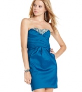 Gorgeous rhinestones and beads frame a sweetheart neckline while perfect pleats accent the bodice on this super pretty party dress from Sequin Hearts!