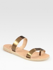 Soft leather footbed topped with glistening metallic leather straps and an unexpected toe ring. Metallic leather upperLeather lining and soleMade in GreeceOUR FIT MODEL RECOMMENDS ordering true whole size; ½ sizes should order the next whole size up. 