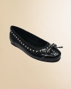 Spectator detailing on a patent flat sharpened with silvery studs.Elasticized grosgrain ribbon opening for great fitStudded bowFaux patent leather upperFlexible constructionSoft microfiber liningPadded insoleRubber soleImportedPlease note: Strap on sizes 8-13 