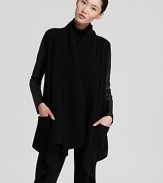 This signature Donna Karan New York cozy is the picture of modernity, rendered in ultra-soft wool and cashmere with supple leather sleeves. Choose it as a chic alternative to a jacket this fall.