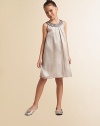 She'll be dressed to impress in this simply gorgeous, embellished chiffon frock.Beaded jewel necklineSleevelessBack zipperHem falls above kneeFully linedPolyester chiffonDry cleanImported