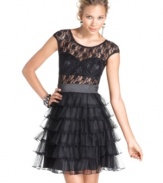 Roberta's update to the classic little black dress adds edge and flair with a chic lace top and sultry bustier! Chic ruffles at the skirt complete its hot look!