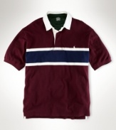 A classic-fitting, short-sleeved striped polo shirt is cut for a comfortable fit in smooth cotton mesh with a polished striped pattern. (Clearance)