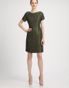 Crocodile pattern gives this lustrous design a hint of the exotic.Short sleevesPrincess seams, front and backConcealed back zipperLinedAbout 22 from natural waist82% acrylic/15% wool/3% polyesterDry cleanMade in USA of imported fabricModel shown is 5'10 (177cm) wearing US size 4. 