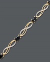 Indulge in style that's eternal. Victoria Townsend's infinity link bracelet sparkles with the addition of oval-cut sapphires (4 ct. t.w.) and round-cut diamond accents. Crafted in 18k gold over sterling silver. Approximate length: 7-1/4 inches.