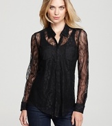 Top off your favorite pair of jeans with this sheer lace GUESS top.