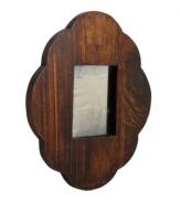 A feminine scalloped edge contrasts a chunky wood design, making the Scallop and Square mirror by Regina Andrew an utterly charming addition to any master suite.