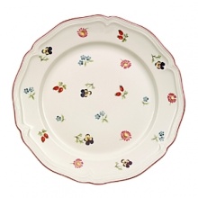This graceful dinnerware collection features a beautiful design of patterned flowers, gently scalloped borders and a red accent line to give your table setting a welcome touch of color. Crafted from fine porcelain, this fine plate brings charm to your salad presentation, perfect for everyday use and formal events alike.