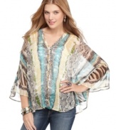 Prints of all stripes unite in this chiffon poncho top from Fire! Pairs perfectly with fun accessories for an effortless weekend look.