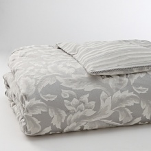 Shimmering in a platinum floral print, this duvet adds a touch of refined charm to your bedroom. Features a striped print on reverse.