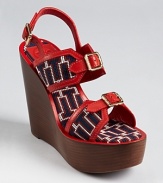 Overflowing with unique details, the Tory Burch Florian wedges offer modern Americana. In patriotic red, white and blue, this standout shoe isn't afraid to show off its fashionable allegiances.