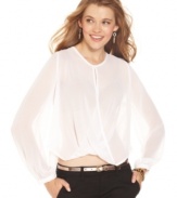 Sheer chiffon drapes softly and forms a novel crisscross design on this dream top from XOXO.