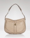 Air on the side of sumptuous with Burberry's chain-trimmed leather hobo. With tough-luxe the mood, carry this style with hard-hitting boots and a leather Mac for cool girl style with a British accent.