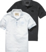Elevate your classic polo style with this pique polo shirt from Guess.