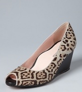 A standout snow leopard print defines these work-or-play open toe wedge pumps. Designer (and orthopedic surgeon) Taryn Rose lends them her signature, won't-want-to-take-them-off comfort.