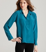 A vibrant jewel tone ignites a sumptuous Eileen Fisher silk blouse for everyday elegance. Set off the shade with silver accents.
