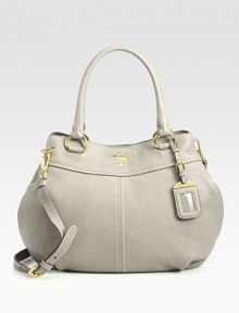 Shapely satchel in pebble-grain calfskin with a removable shoulder strap and logo luggage tag.Double top handles, 6½ dropRemovable, adjustable shoulder strap, 16-20 dropSnap top closureMetal lettering logoBrass hardwareProtective metal feetTwo inside pocketsPrada logo lining15W X 11H X 6DMade in Italy