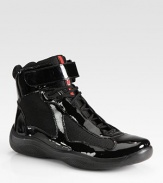 Shiny patent leather lace-ups with mesh details. Ankle tab closure Rubber sole Imported 