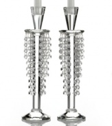 Candlestick meets chandelier in glamorous Barcelona candle holders from Lighting by Design. Glistening beads dangle between the light above and faceted base below for a pair with old-world grandeur.