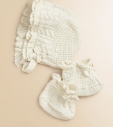 An adorable bonnet-and-bootie set is rendered in soft cable-knit cotton.Adjustable buttoned chin strapAdjustable booties with cordCottonMachine washImported