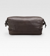 EXCLUSIVELY OURS. We've taken the classic toiletry bag and given it a handsome update in calfskin leather with a reinforced bottom and waterproof lining. Top zip closure Lined in waterproof taffeta 9W X 7¼H X 3¾D Imported 