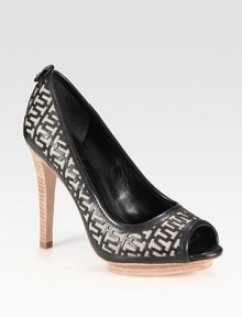 Stretchy linen silhouette with a logoed leather overlay and an island platform. Stacked heel, 4 (100mm)Island platform, ½ (15mm)Compares to a 3½ heel (90mm)Linen and leather upperLeather lining and solePadded insoleImportedOUR FIT MODEL RECOMMENDS ordering one half size up as this style runs small. 