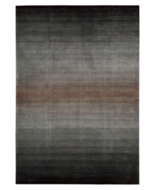 An ombré ground of soothing grays evokes mysterious allure in this area rug from Nourison. Hand tufted of long polyester fibers for added strength and softness, the Contour area rug creates an ideal accent for any modern room. An ombré ground of soothing grays evokes mysterious allure in this area rug from Nourison. Hand tufted of long polyester fibers for added strength and softness, the Contour area rug creates an ideal accent for any modern room.