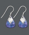 A splash of color adds an artistic touch to your look. Earrings by Jody Coyote feature midnight blue bronze patina teardrops with decorative silver charms. Earrings crafted in sterling silver. Approximate drop: 1 inch.