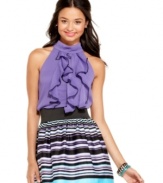 Say yes! to this top from BCX, where stately ruffles and a halter silhouette create the perfect interplay of parts!
