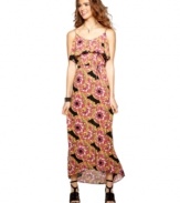 6 Degrees designs a maxi dress for the modern day flower child, teaming a billowy, ruffled neckline with a bold print that depicts flowers made from colorful feathers!
