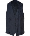 The classic vest gets an edgy-cool update with a distressed crinkled look and a slim, modern fit - Four-button placket, two chest and two waist slit pockets, adjustable back belt - Style with a clean button down, slim trousers, and lace-up dress shoes