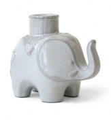 From tusk til dawn. Jonathan Adler brings the Indian elephant to life and to light with this glazed white candlestick, crafted of high-fired stoneware.