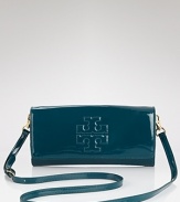 For night, Tory Burch dresses up it's clutch in glossy patent leather. Ideally sized to tuck inside a tote and take to dinner. it's a slick way to take your style out for the evening.
