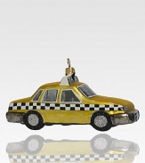 Although the real checker cabs no longer roam the city streets, this sparkling ornament recalls the heyday of these roomy roadsters, crafted of delicate glass with glitter wheels.Handmade and hand-paintedGlassAbout 5L X 2.75H X 2DImported
