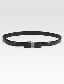 Rendered in shiny patent leather with silvertone bow buckle.Width, about .78Made in Italy