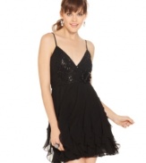 How stunning! Rows of soft ruffles balance the sequin bodice of a B. Darlin dress that's full of dark whimsy.